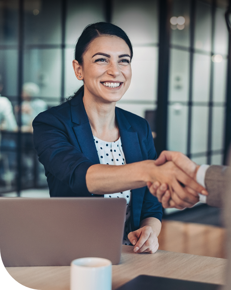 Businesswoman shaking hands with customer